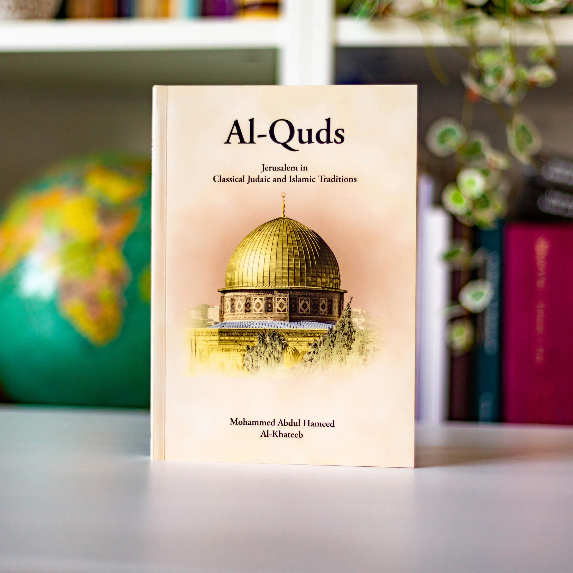 Upright book in library of Al-Quds, Jerusalem in classical Judaic and Islamic Traditions by Al-Khateeb. Islamic Jerusalem history by Ta-Ha Publishers
