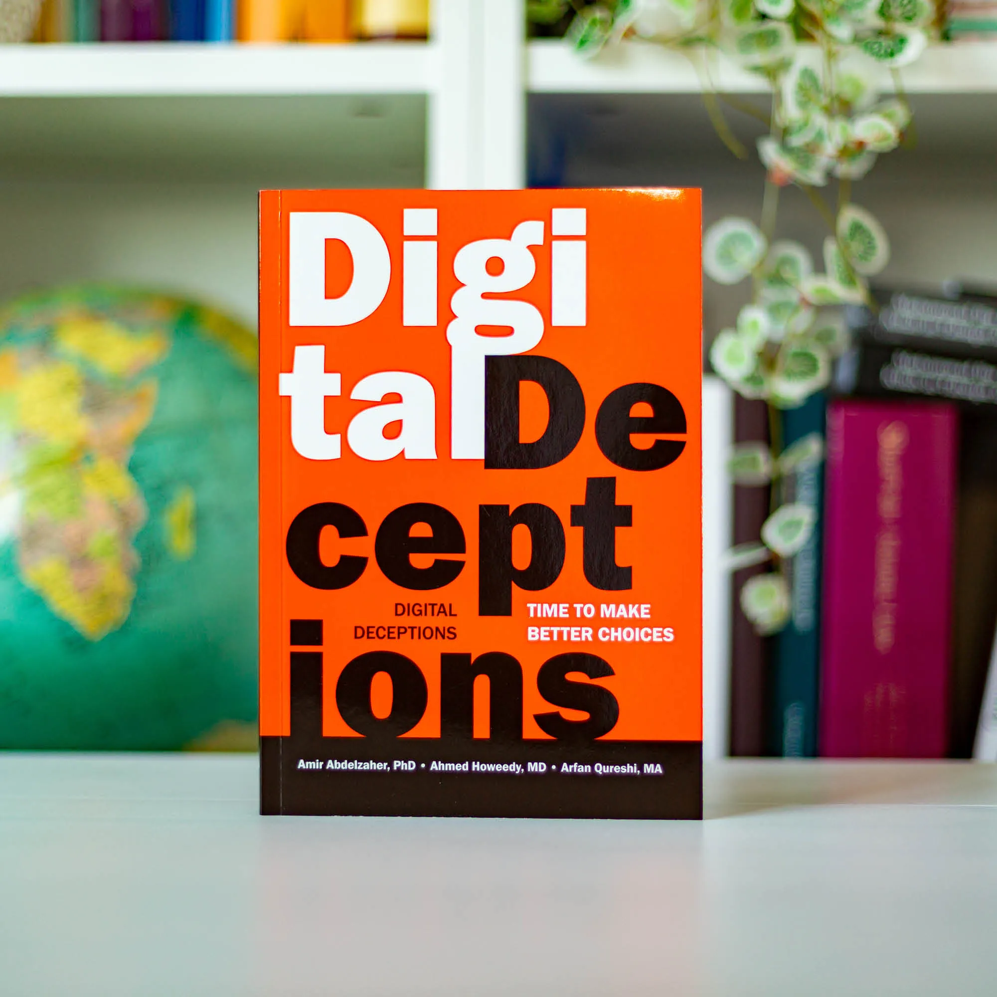 Upright book in library of Digital Deceptions by Abdelzaher, Howeedy, Qureshi. Islamic smartphone usage guide by Ta-Ha Publishers