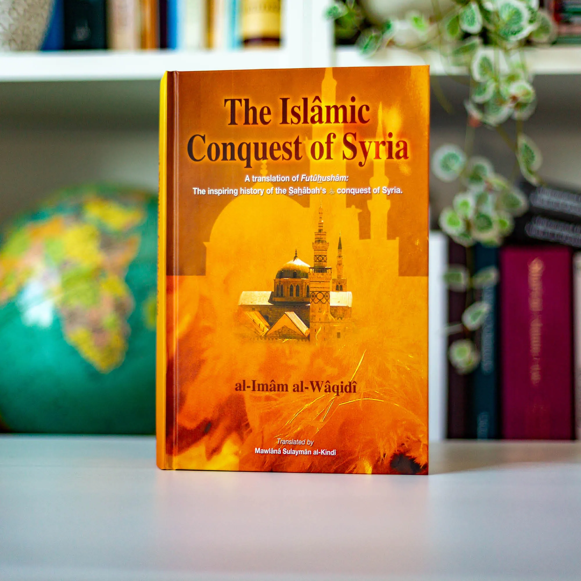 Upright book in library of The Islamic Conquest of Syria, A Translation of Futuhusham: The inspiring history of the Sahabah’s conquest of Syria by Al-Waqidi, Al-Kindi. Futuhusham translation by Ta-Ha Publishers