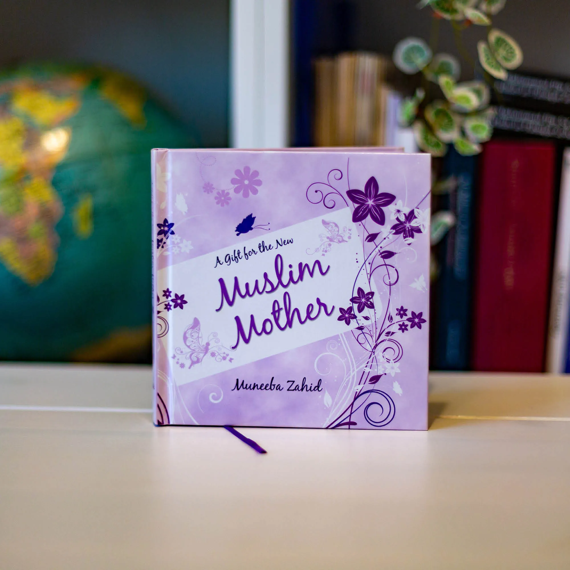 Upright book in library of A Gift for the New Muslim Mother by Muneeba Zahid. Guide for new Muslim mother by Ta-Ha Publishers