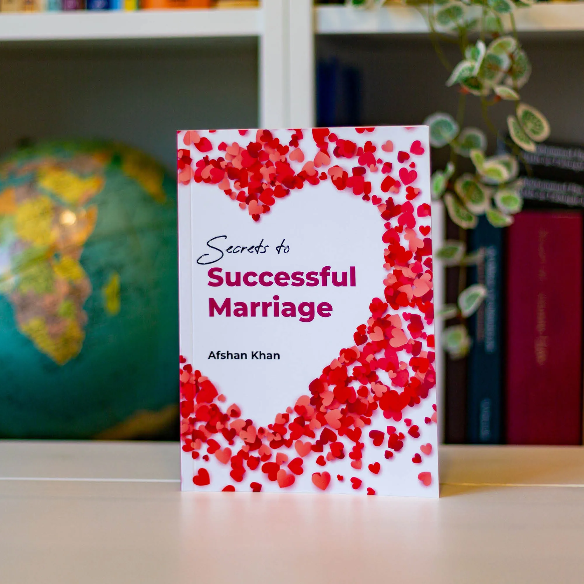Upright book in library of Secrets to Successful Marriage by Afshan Khan. Islamic marriage guide by Ta-Ha Publishers