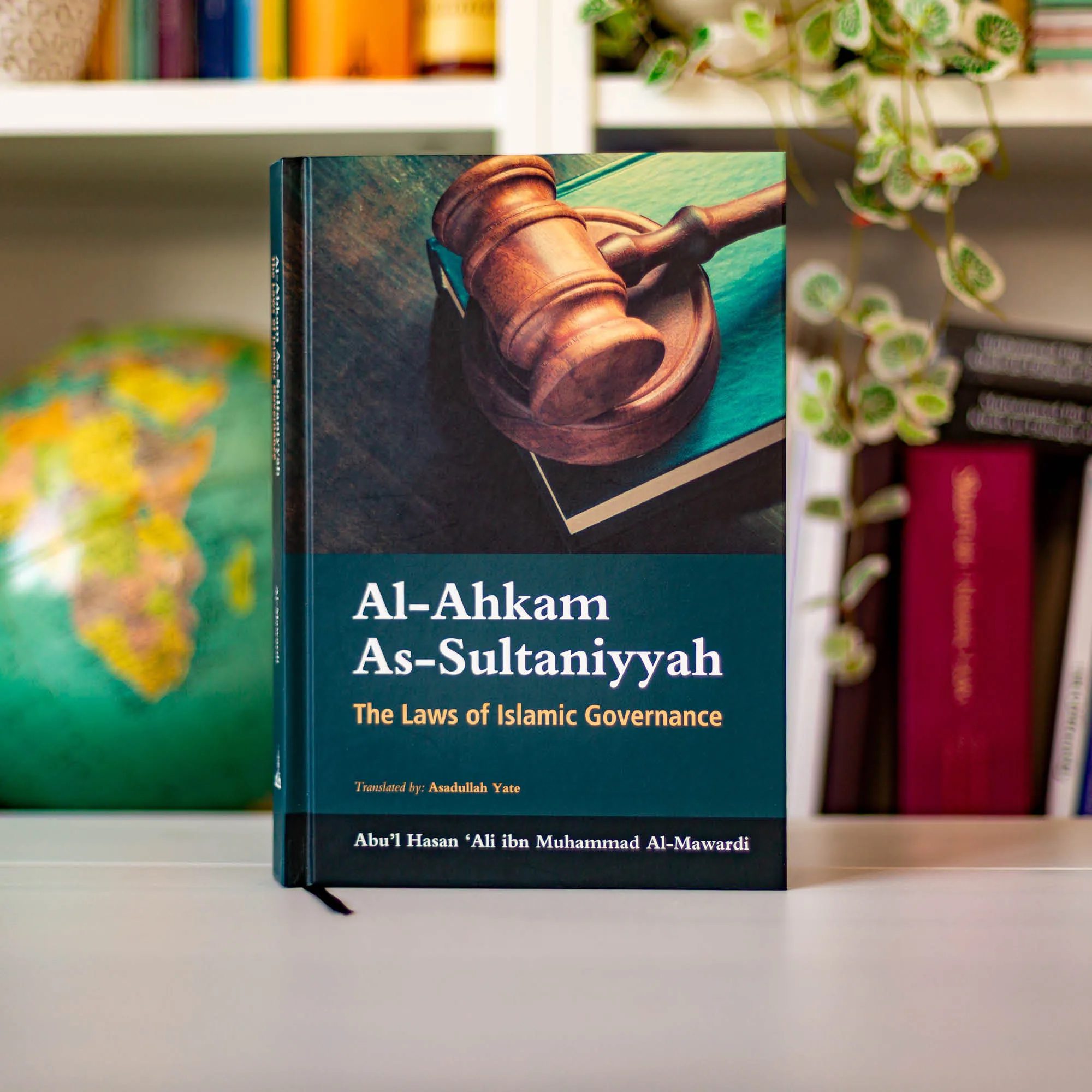 Upright book in library of Al Ahkam As-Sultaniyyah by Abu’l Hasan ‘Ali al-Mawardi, Dr Asadullah Yate. Islamic governance book by Ta-Ha Publishers