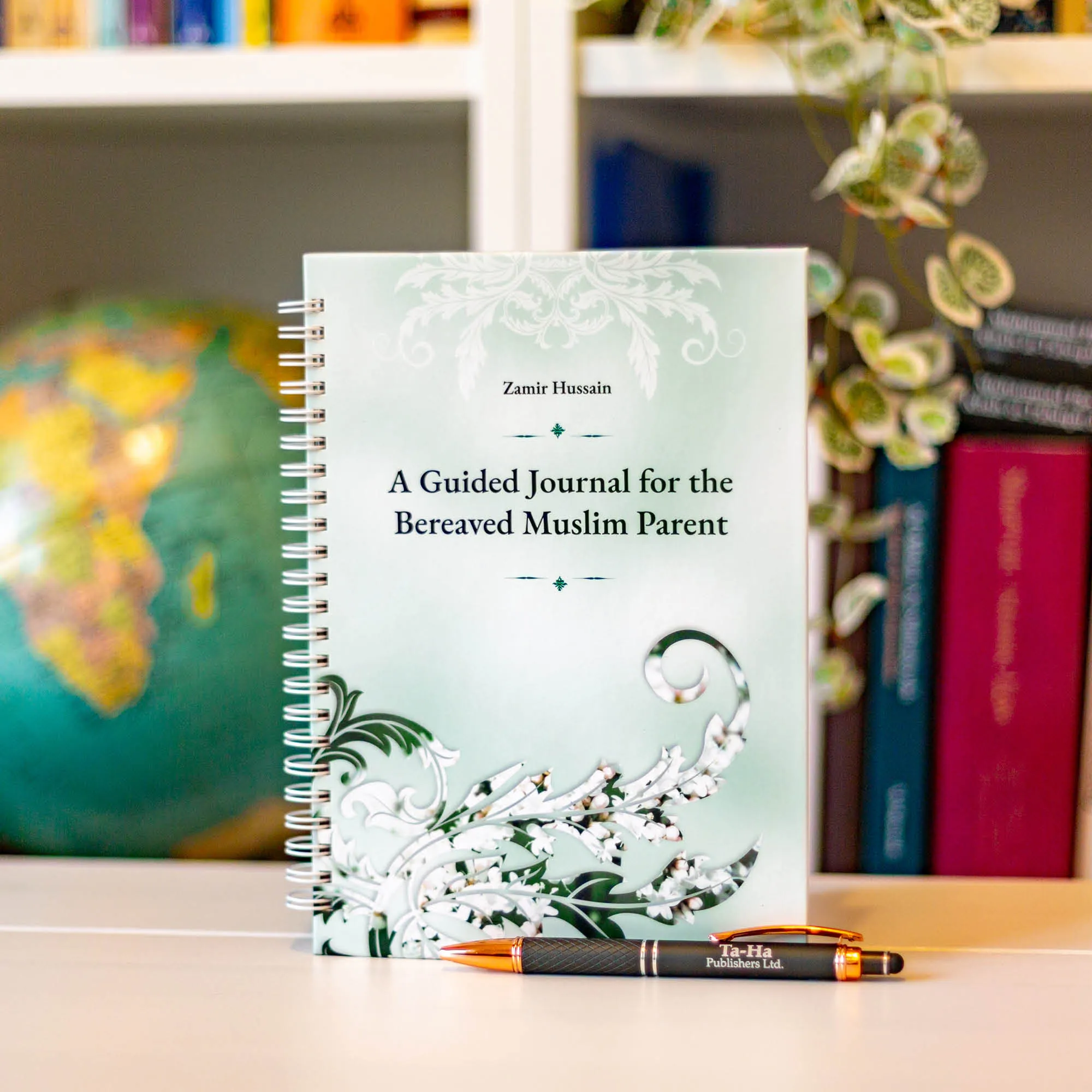 Upright book in library of A Guided Journal for the Bereaved Muslim Parent by Zamir Hussain. Islamic child loss journal by Ta-Ha Publishers
